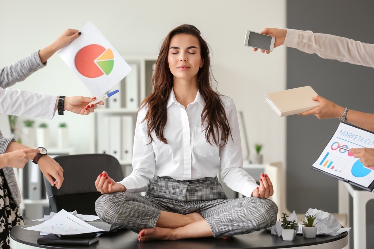 Woman Centering Herself at Work