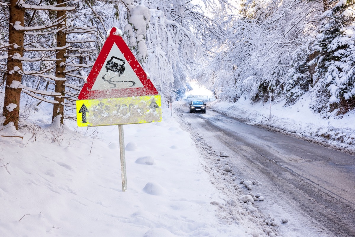 Car driving on icy winter road