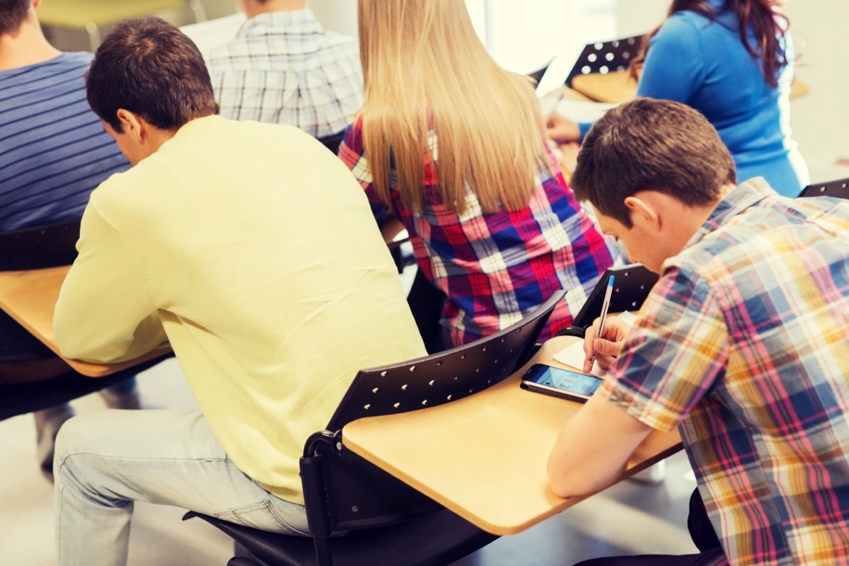 student texting in class