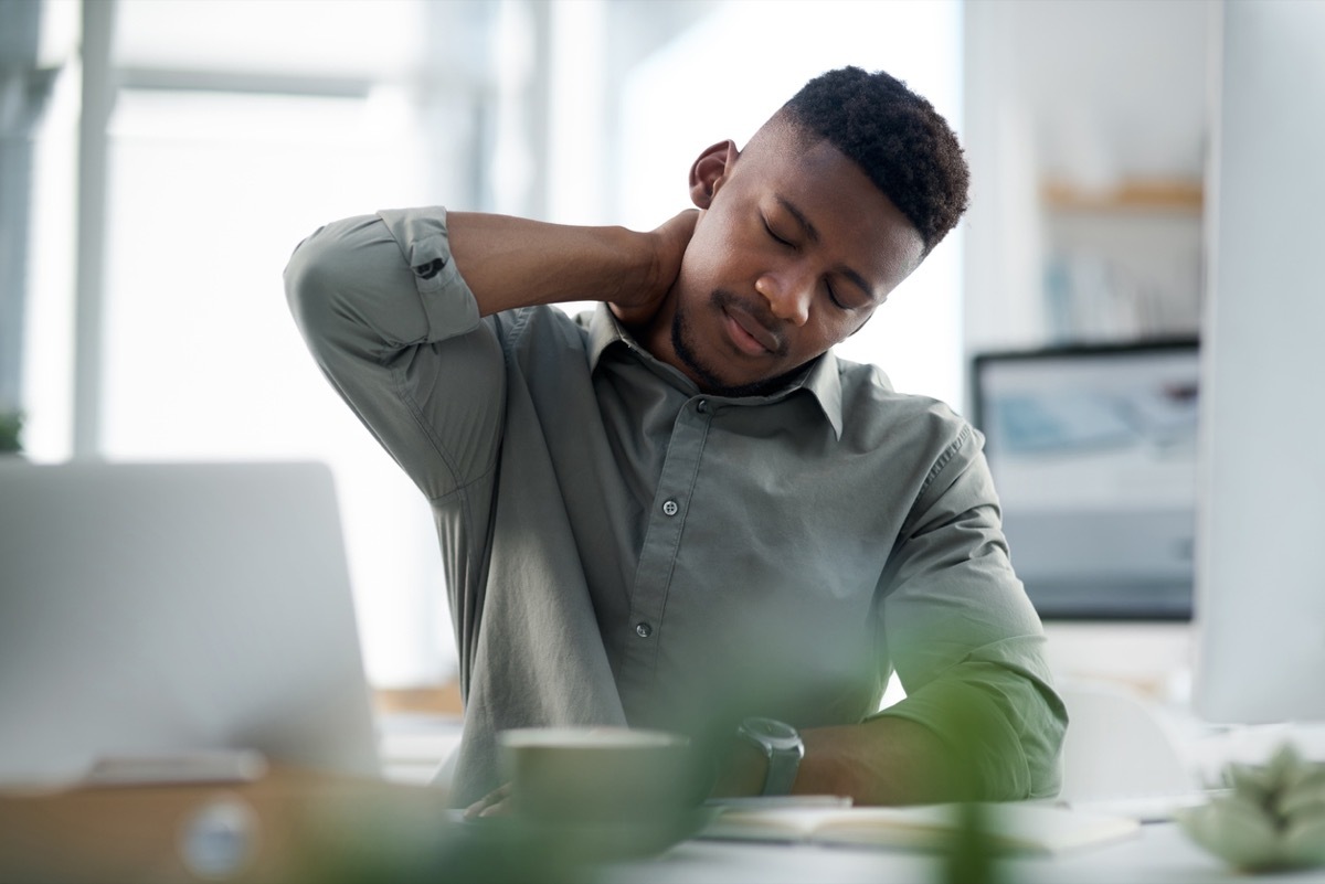 Shot of a young businessman working on a computer in an office