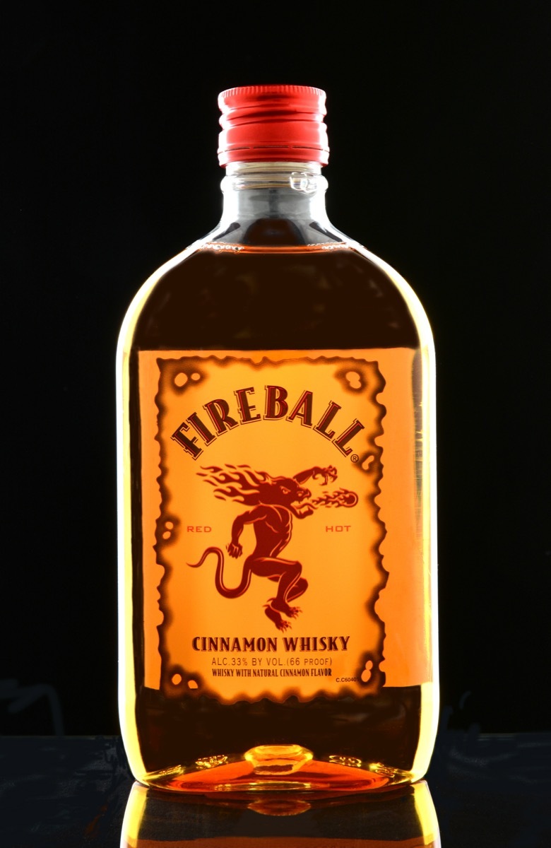 Bottle of fireball in front of a black background