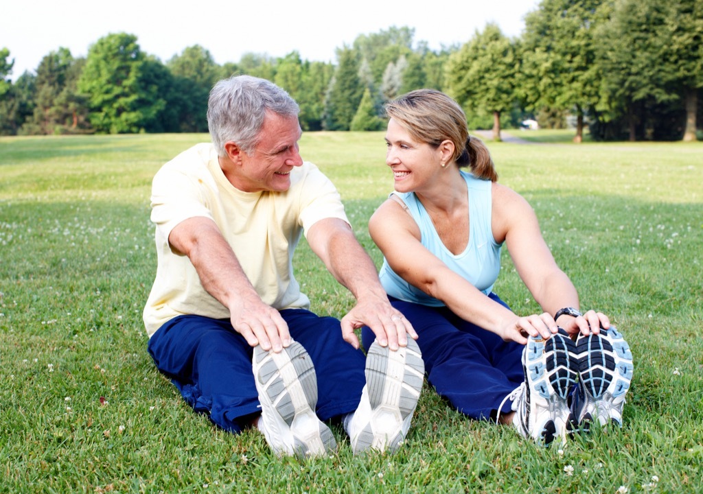 couple stretching outside