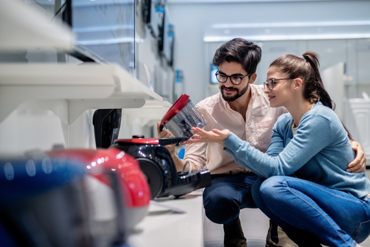 man and woman shopping for vacuum, vacuuming tips