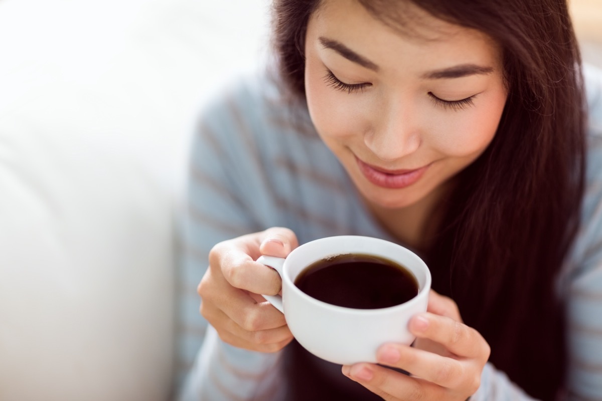 Young Asian woman drinking