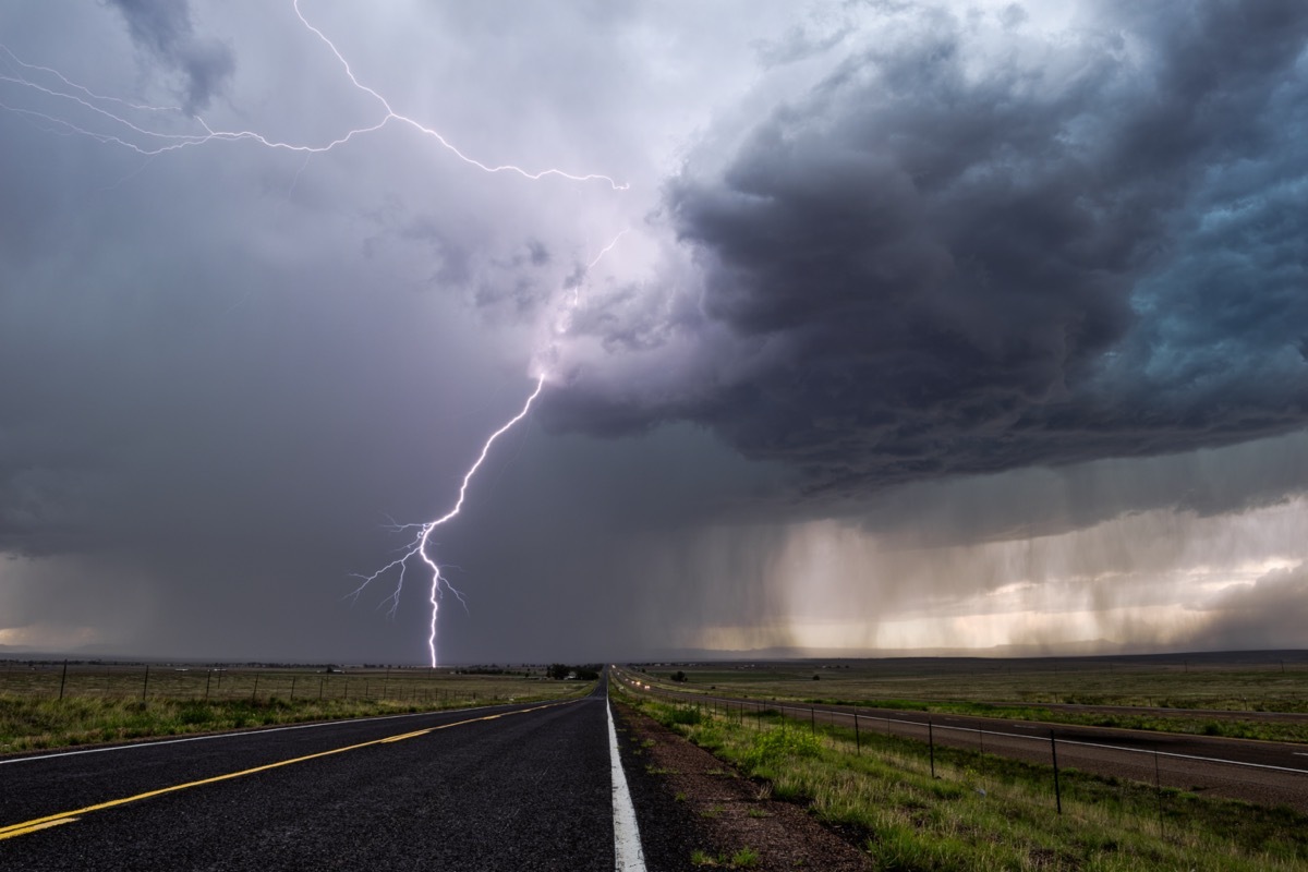 Lightning and thunderstorm over highway