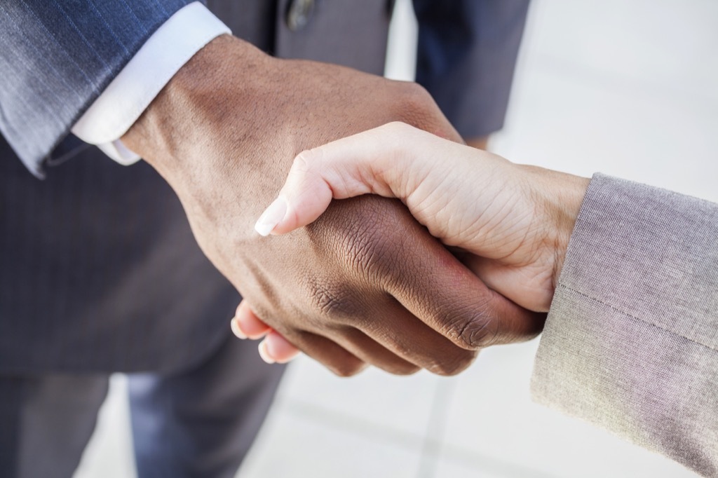 Business partners shaking hands divorce at 40