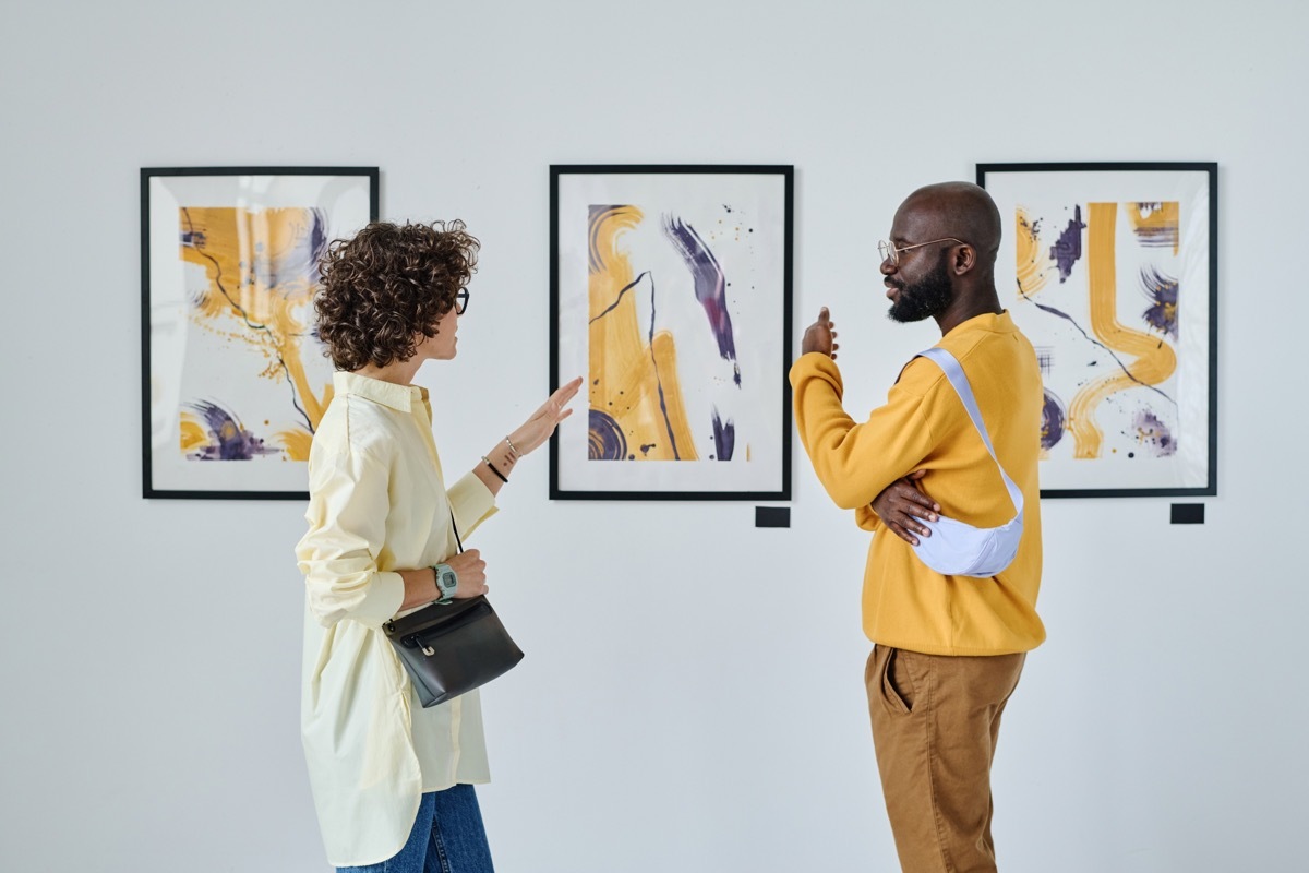 man and woman at an art museum on their first date