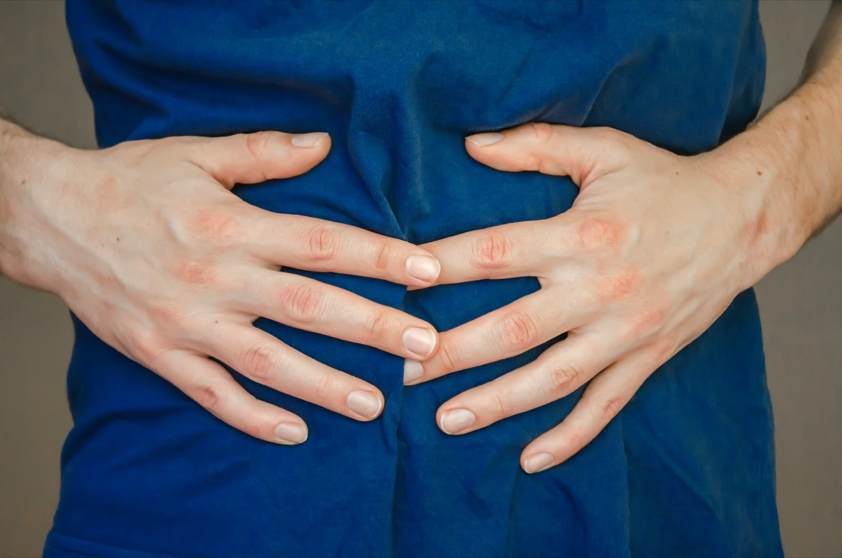 A man holding his stomach.