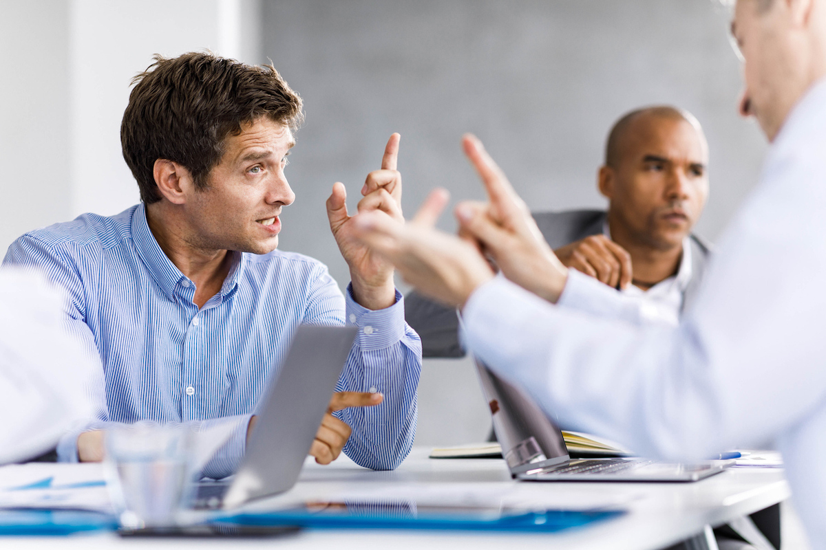 Frustrated entrepreneurs arguing during a business meeting in the office.