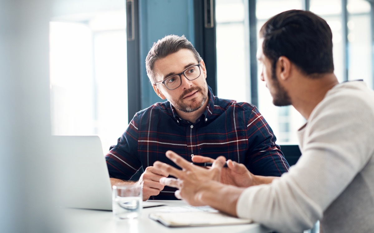 Shot of two businessmen having a discussion in an office