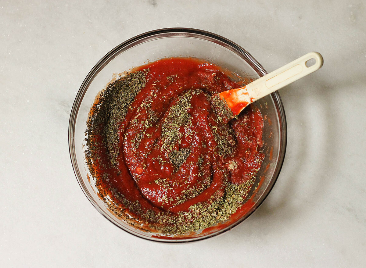 Italian pizza sauce being mixed together in a bowl