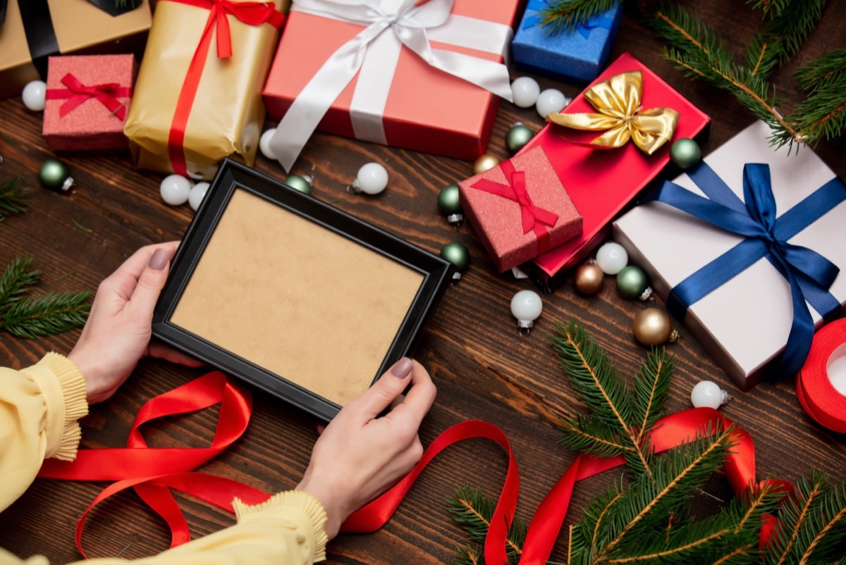 white hands holding picture frame