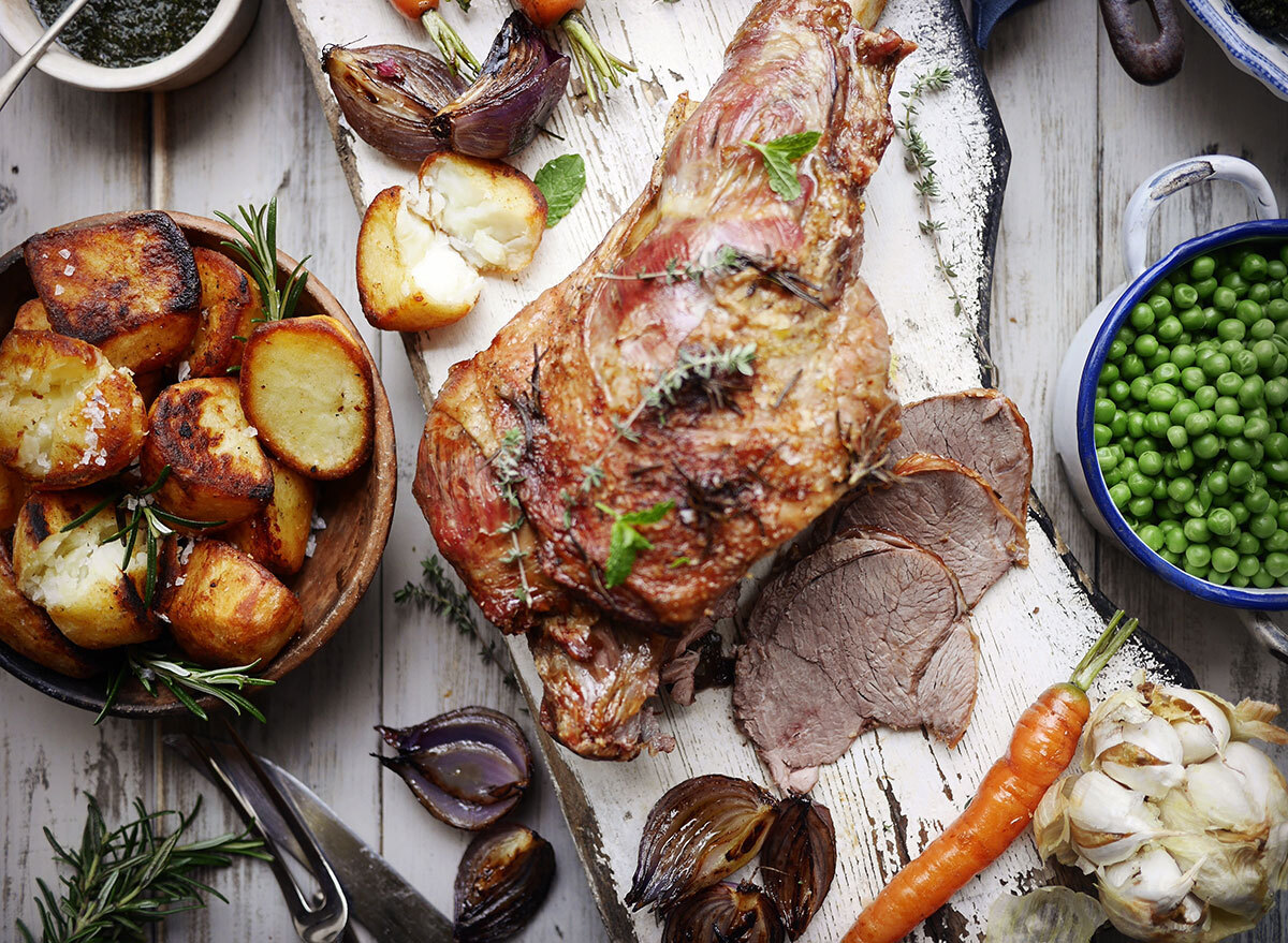 roast leg of lamb with potatoes, garlic, peas