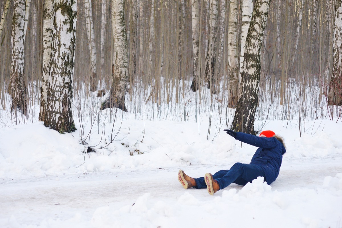 man slipping on snow