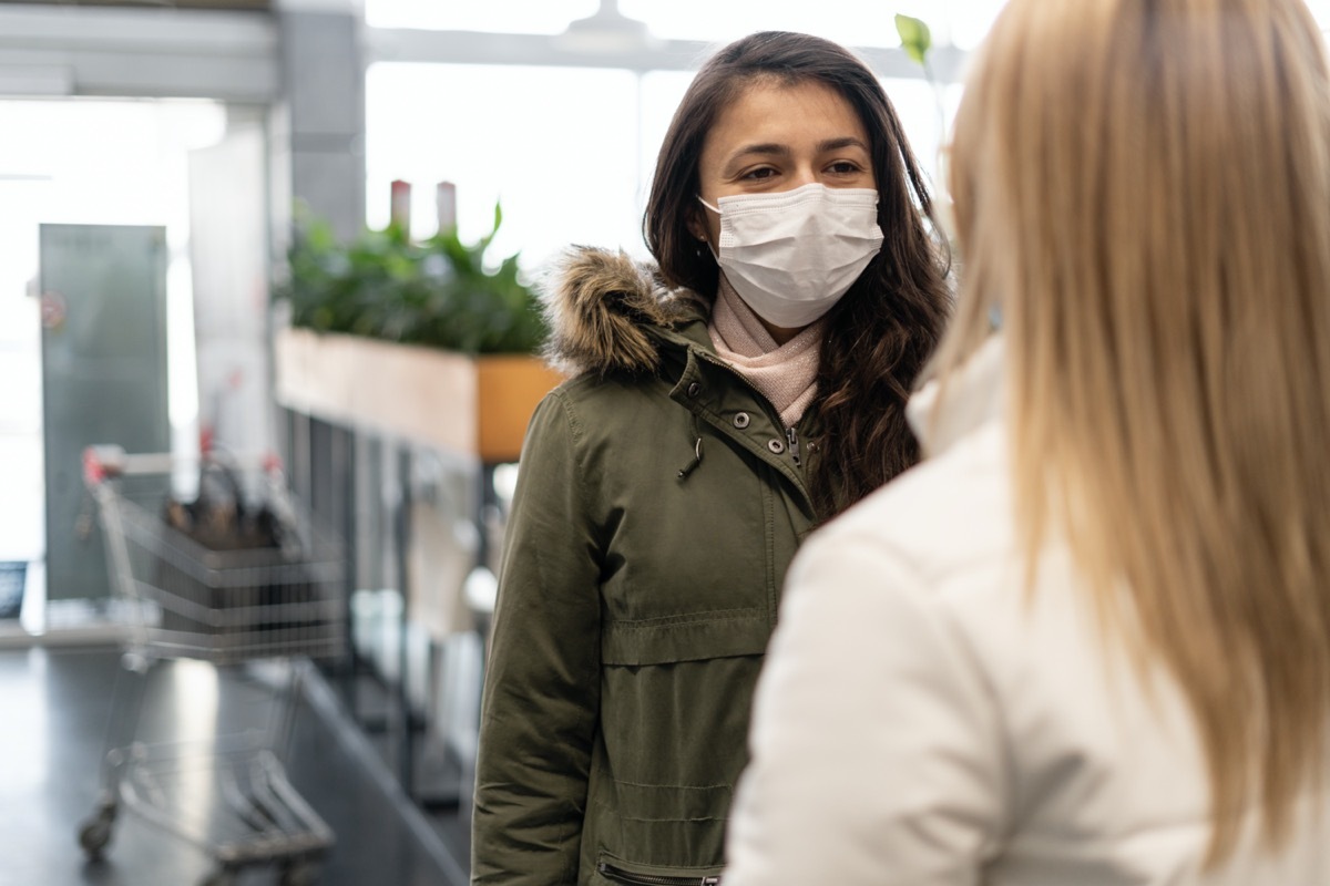 woman traveler wearing face protection in the prevention of coronavirus.