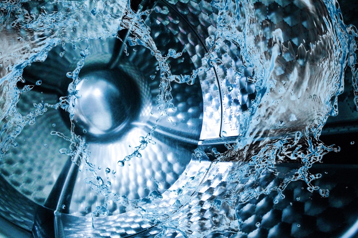 water swirling in close up of inside of washing machine