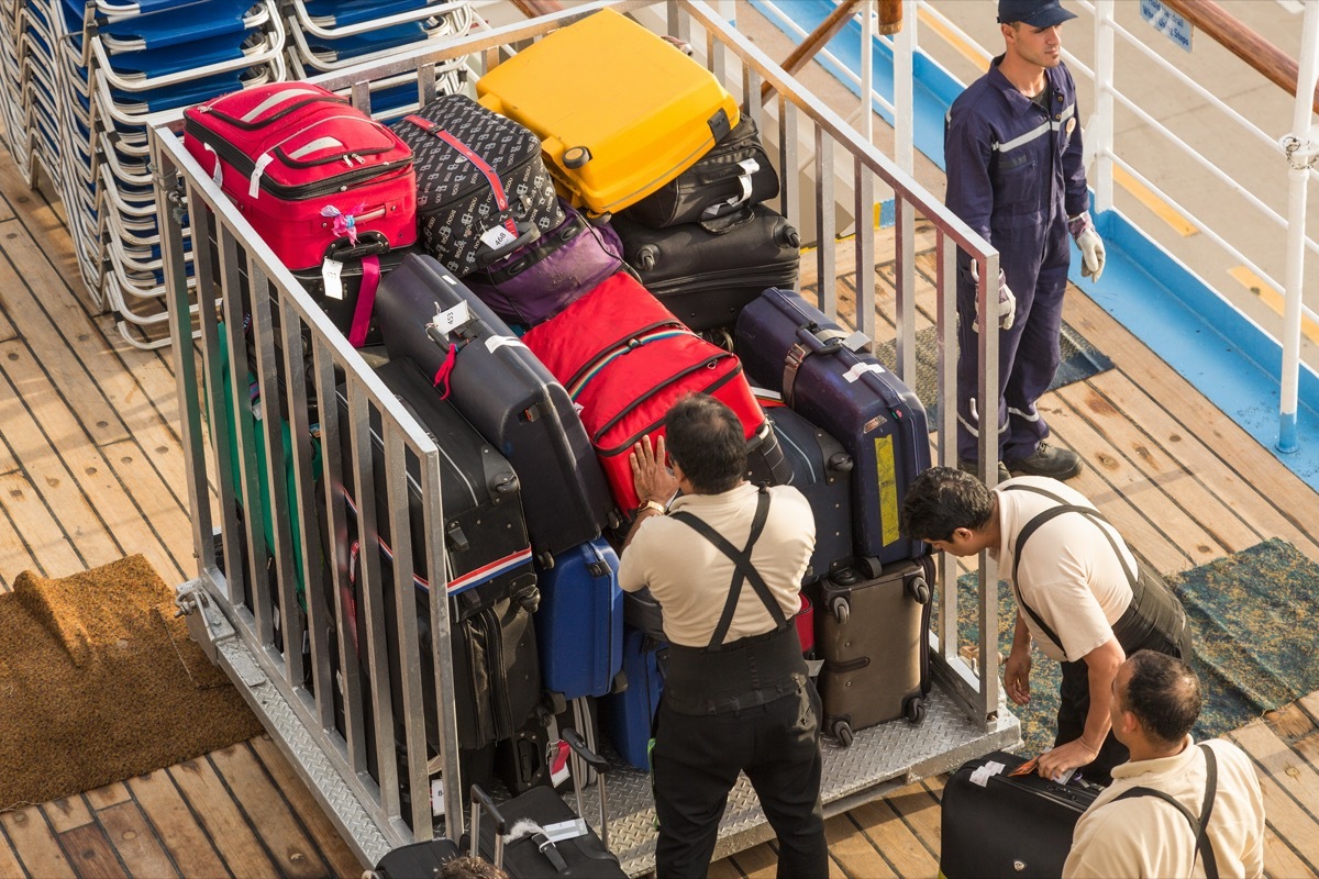 cruise workers unloading luggages