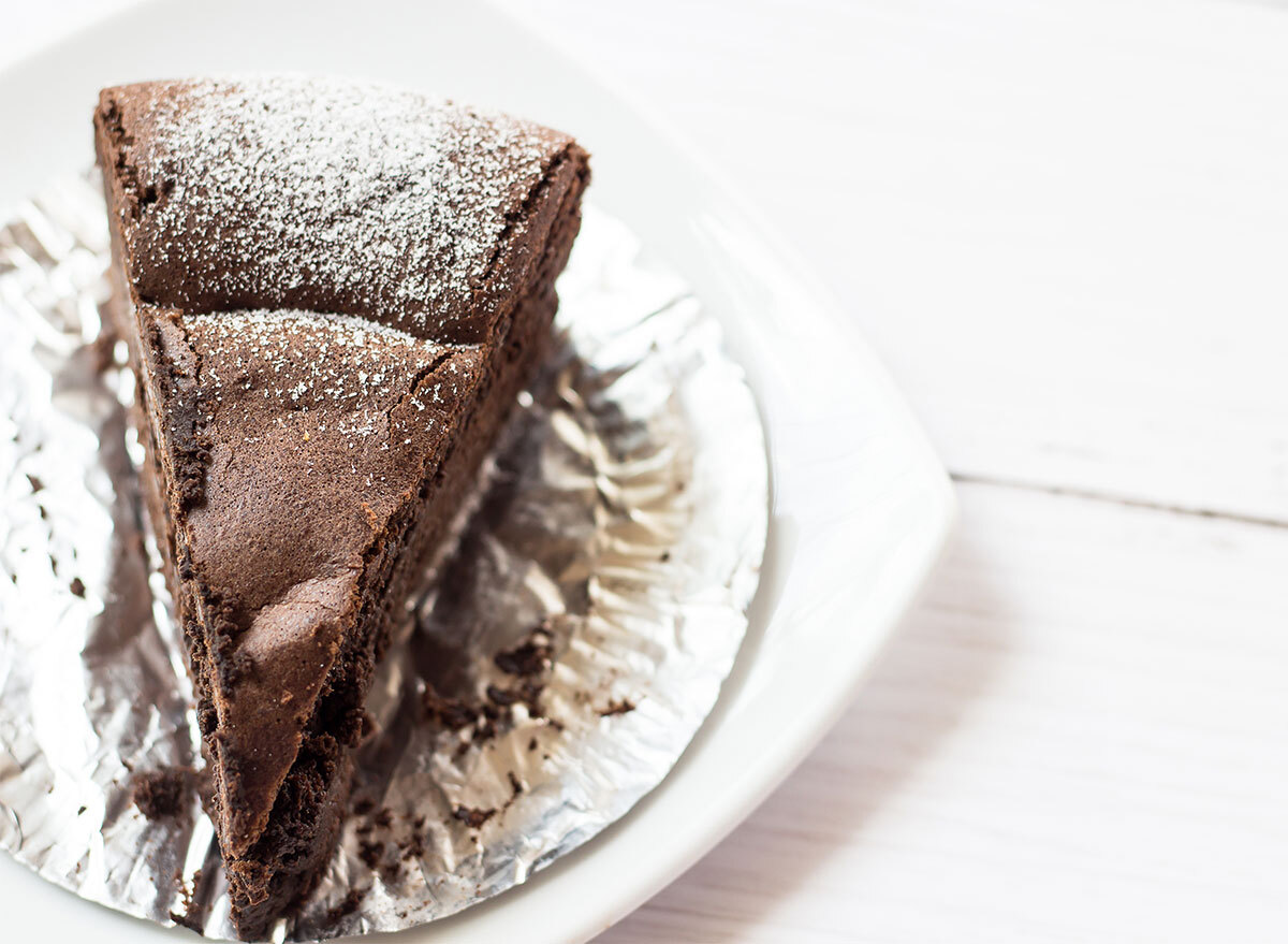 slice of flourless chocolate cake on white plate