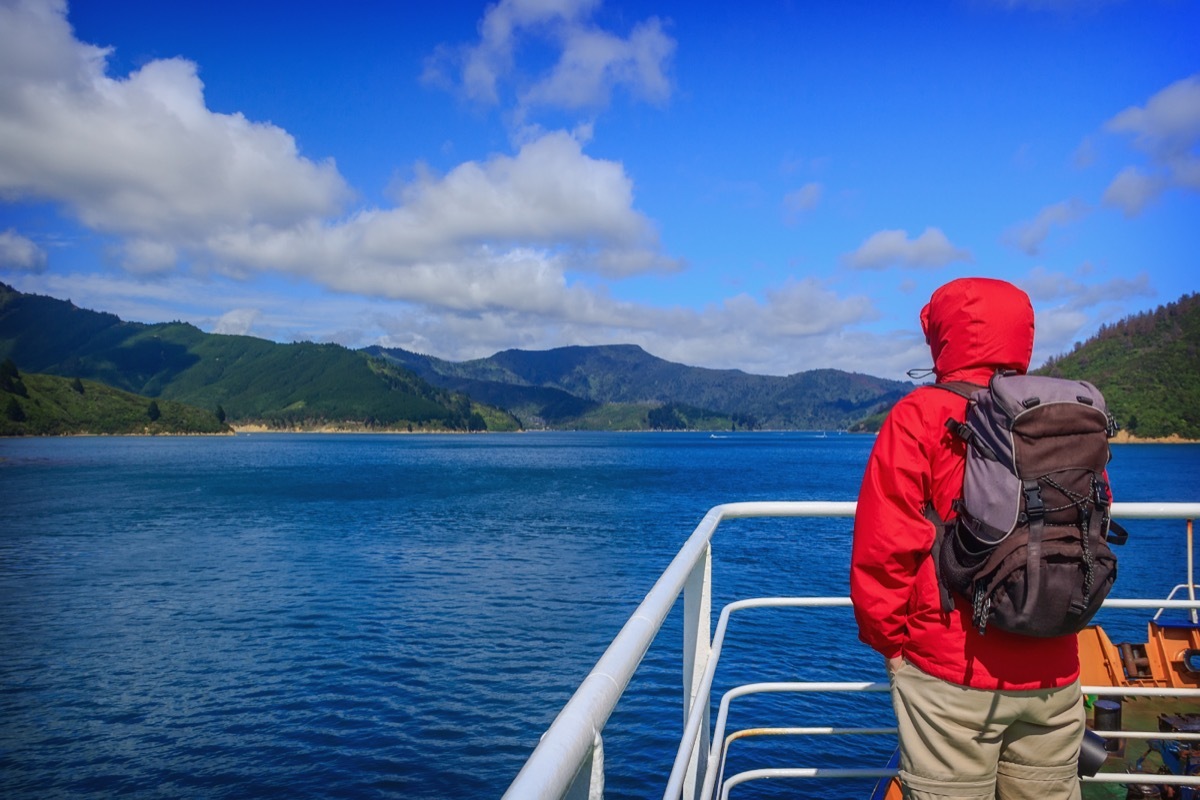 Person standing at boat rail