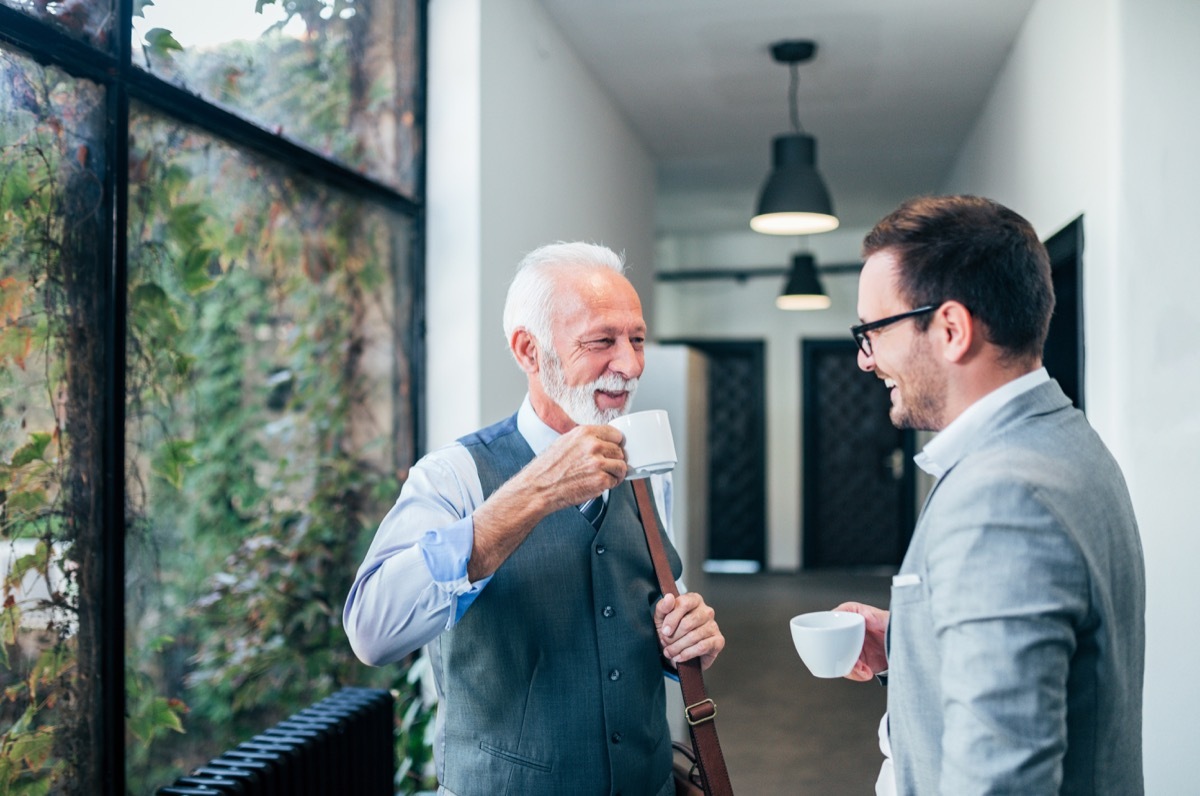 men talking and drinking coffee together