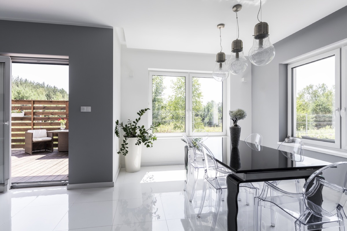 gray dining room with clear chairs