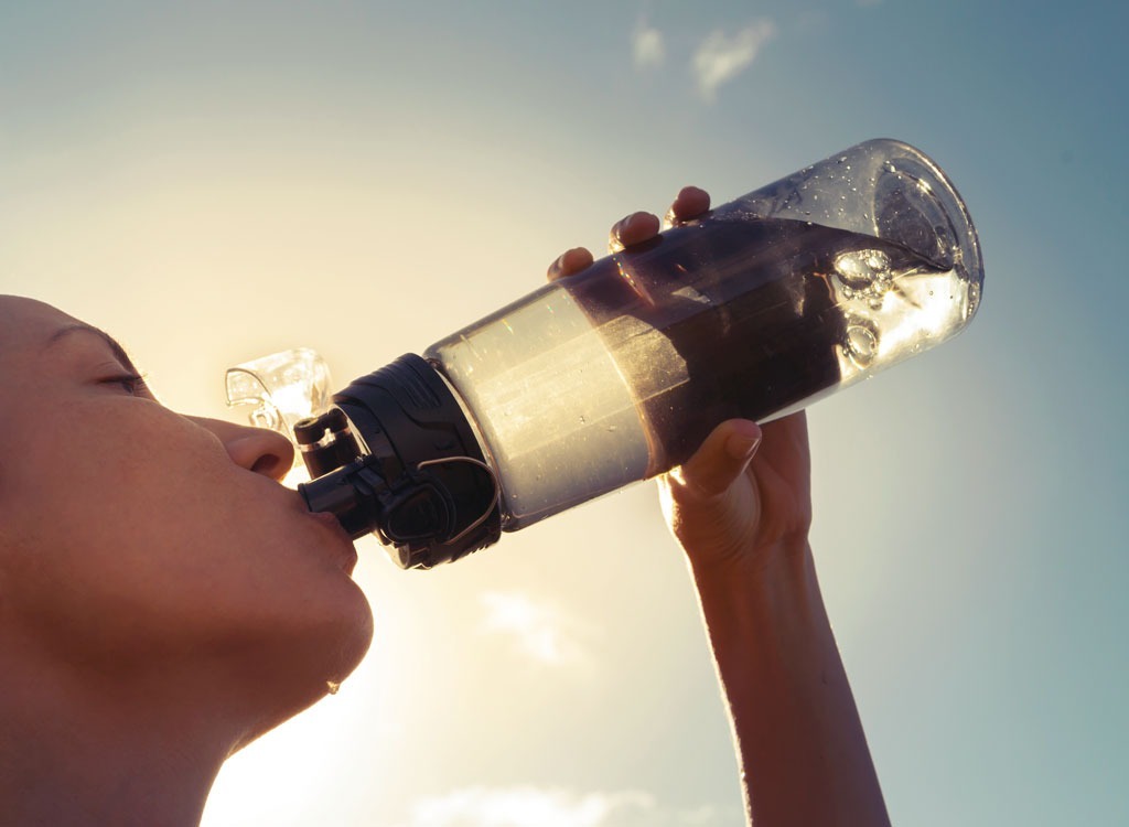 Woman drinking water bottle