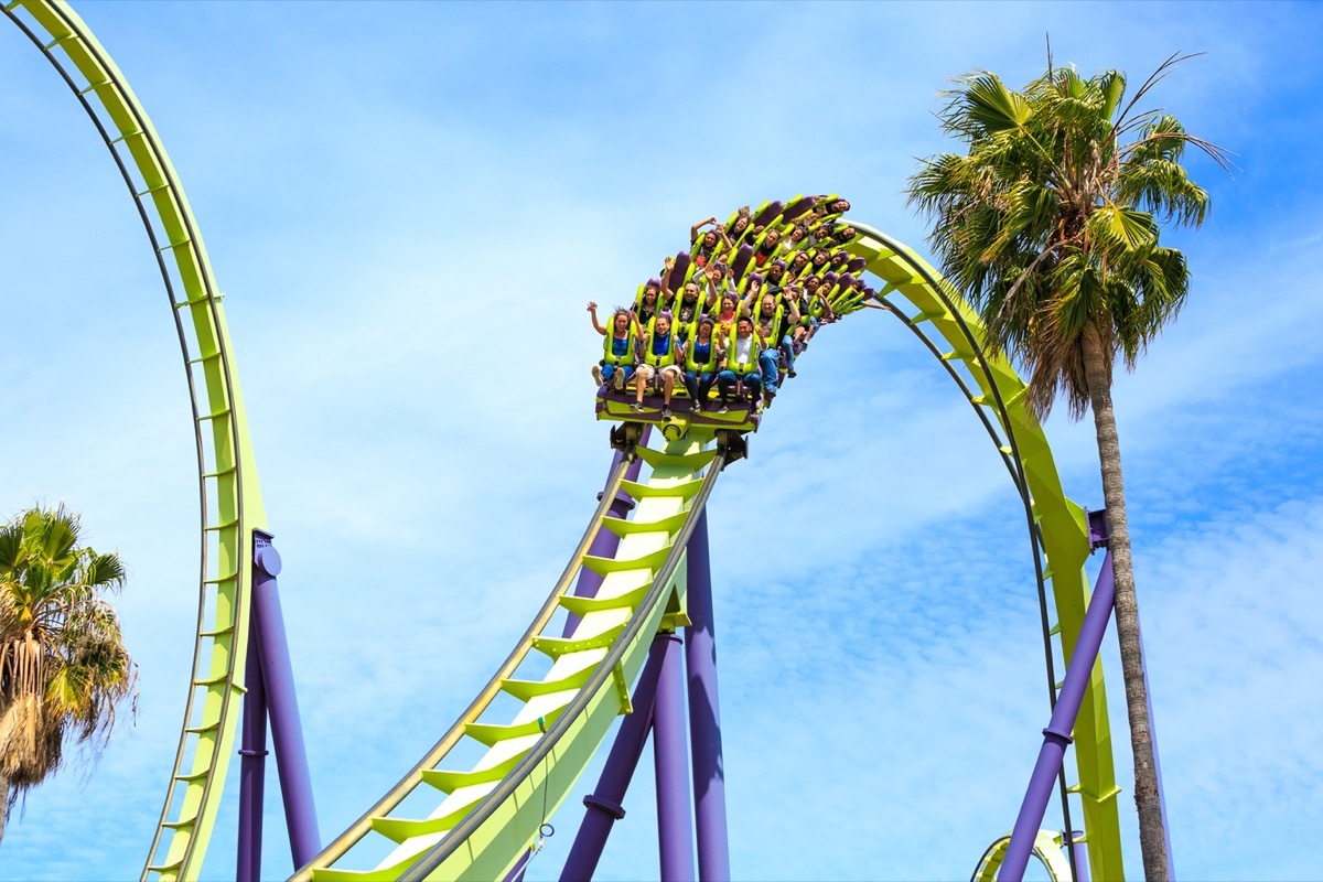 people riding rollercoaster in six flags california