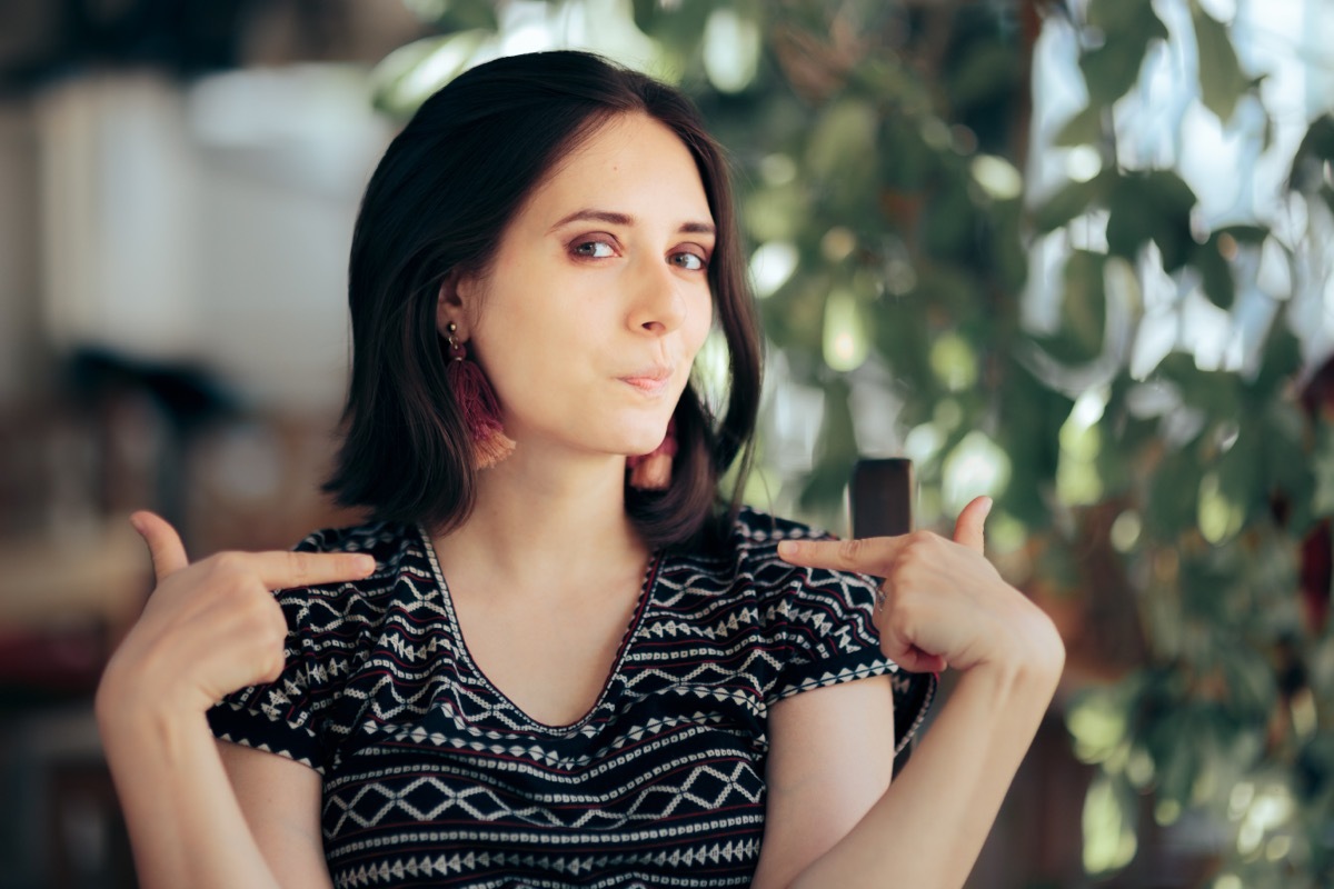 selfish woman pointing to herself