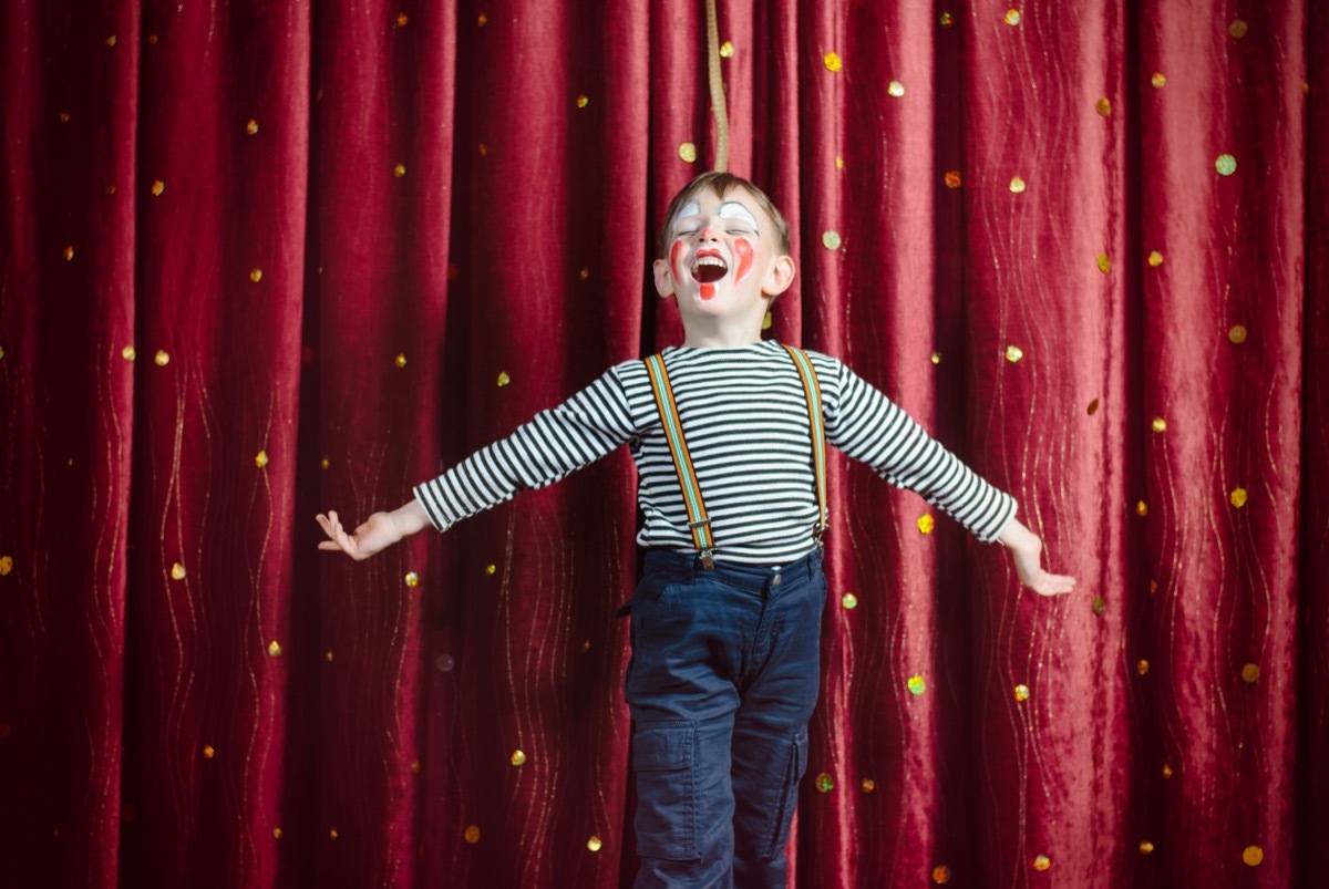 little boy dressed as clown 