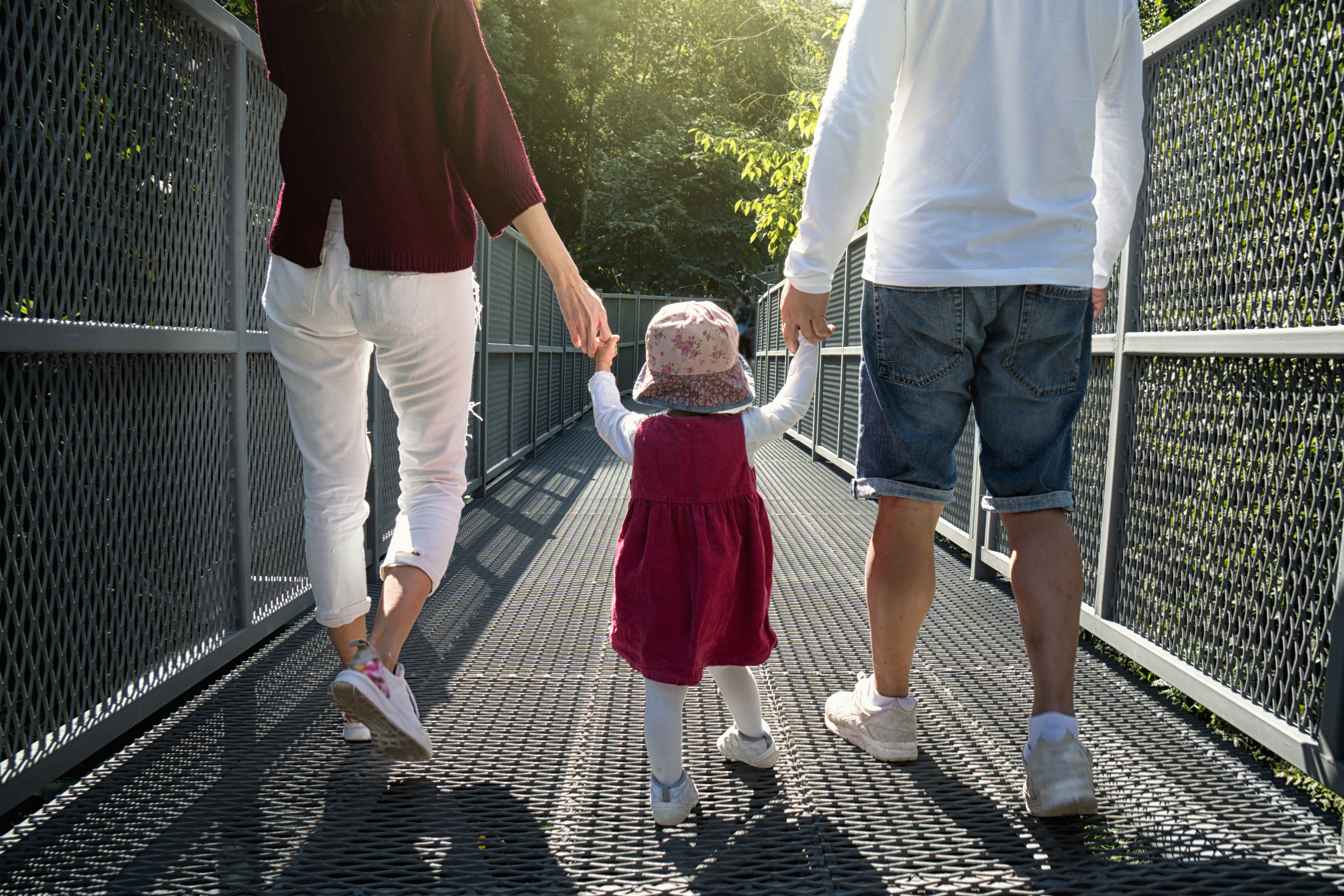 parents walking with toddler