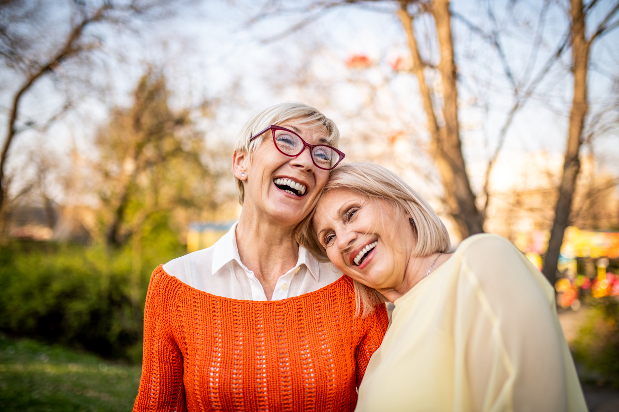 Two senior friends relaxing at the park