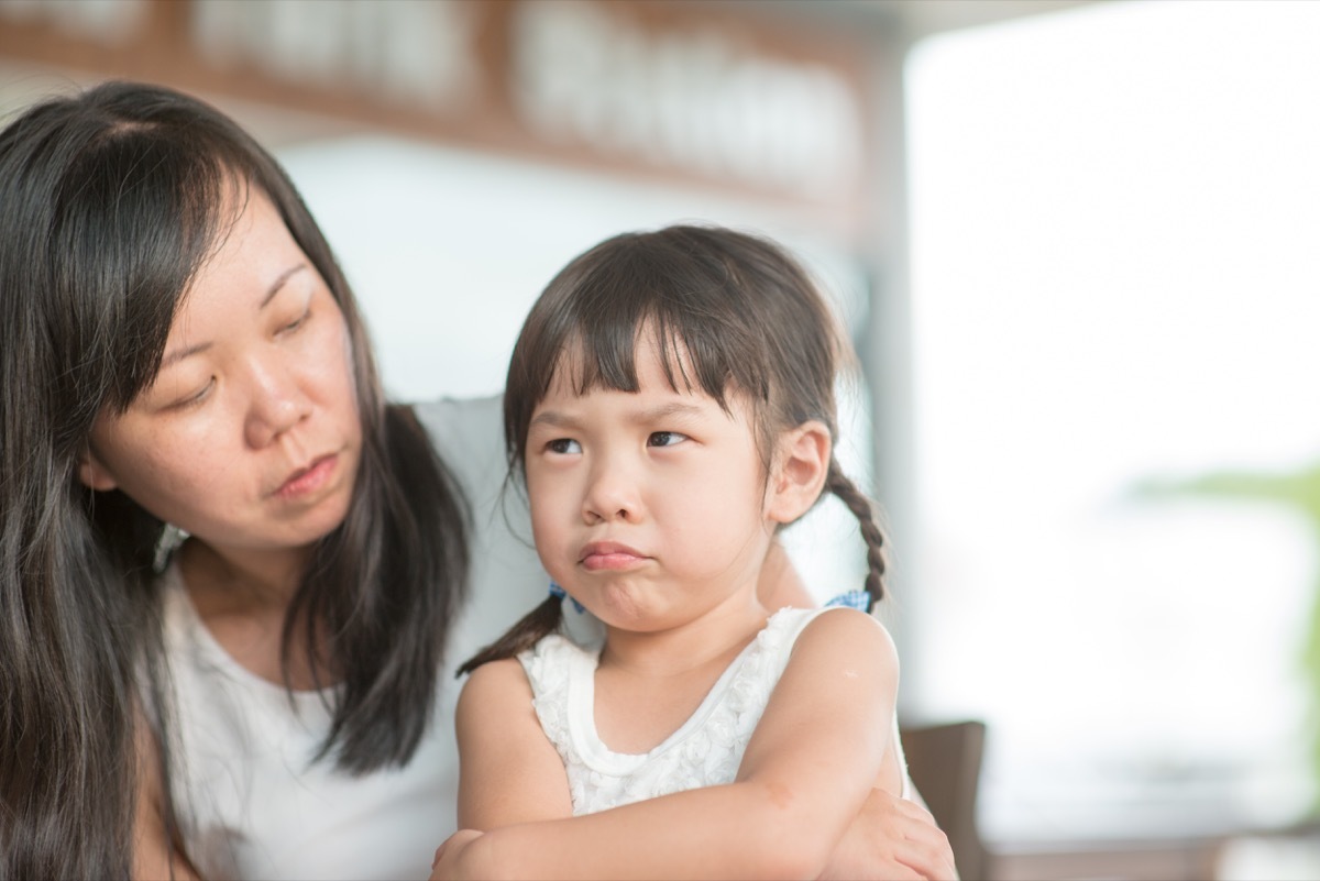 little girl upset with her mother, pouting