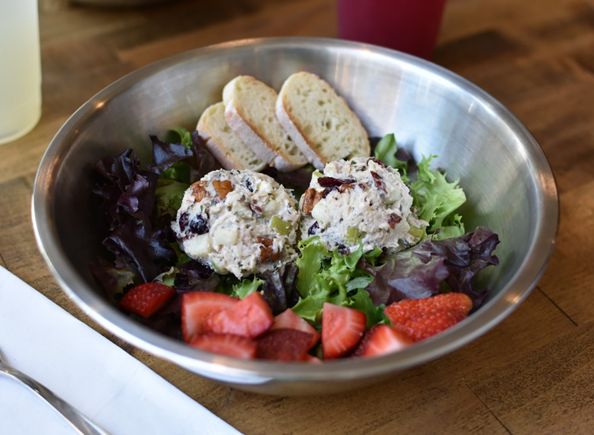 salad in bowl with strawberries and chicken salad