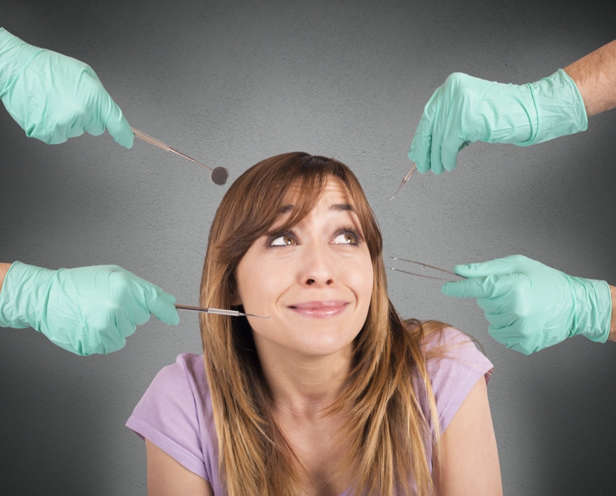 Frightened girl from tools of her dentist