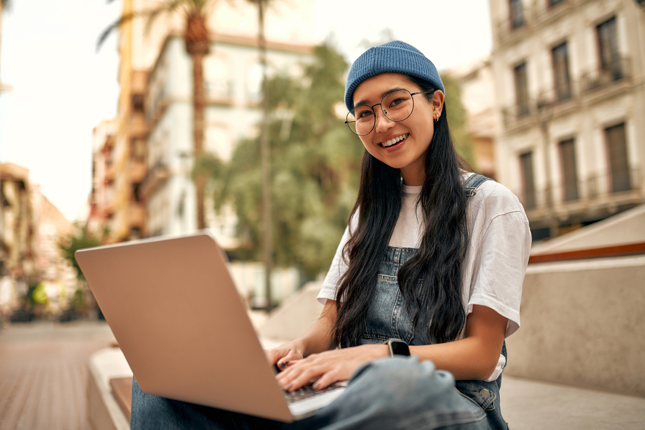 asian woman working on laptop