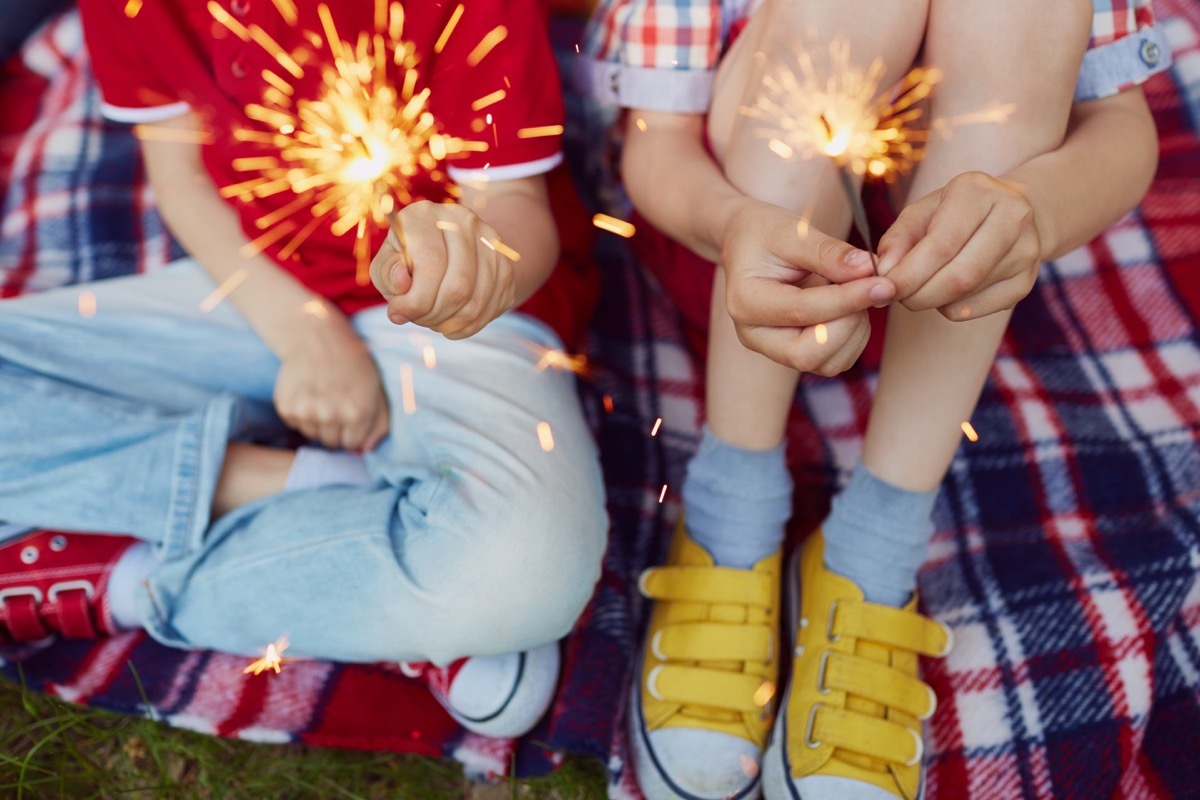 Close-up of sparkler in children's hands