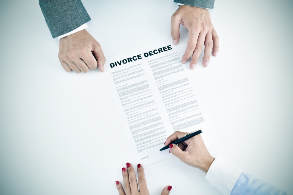 couple signing divorce papers, empty nest