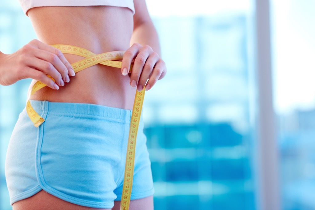 Woman Measuring Waistline Craziest Corporate Policies