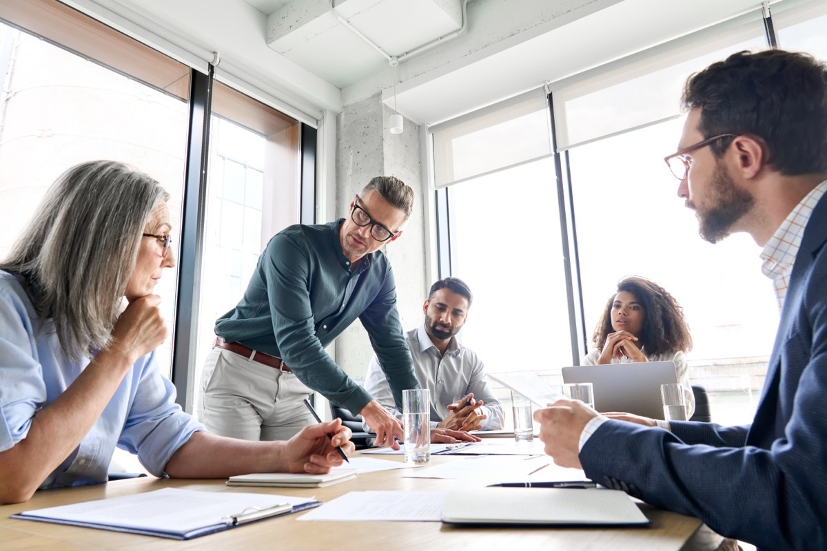 co-workers at a board table