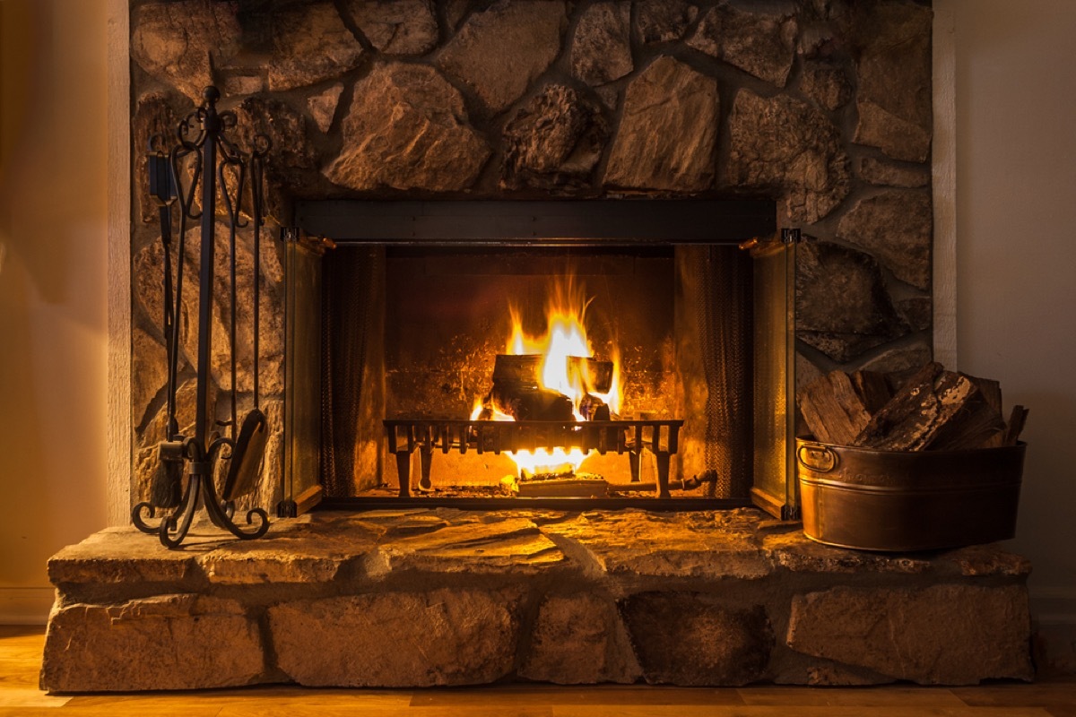 fireplace with stone surround, things you shouldn't store in your basement