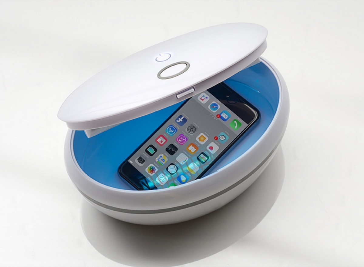 white sanitizing bowl with iphone in it