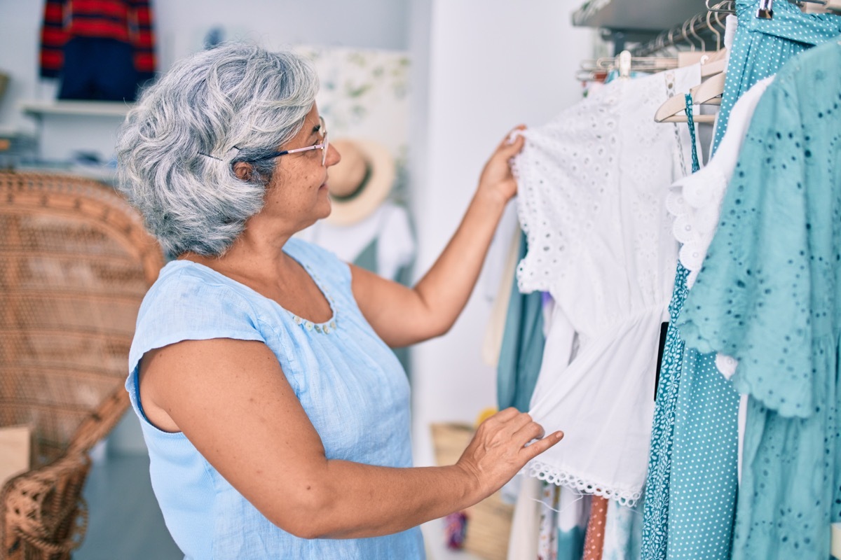 Woman looking through a rack of clothes at a boutique