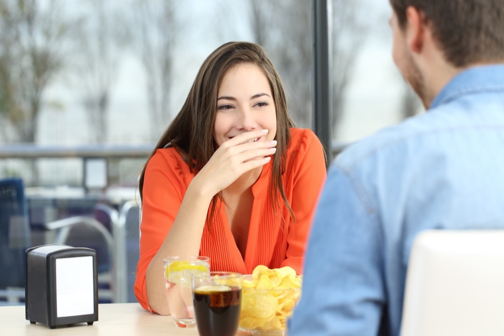 woman laughing at man - what men find attractive in women