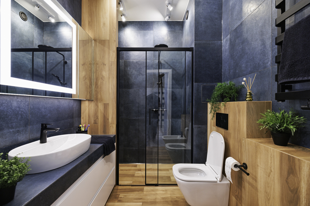 dark blue and wood finished bathroom