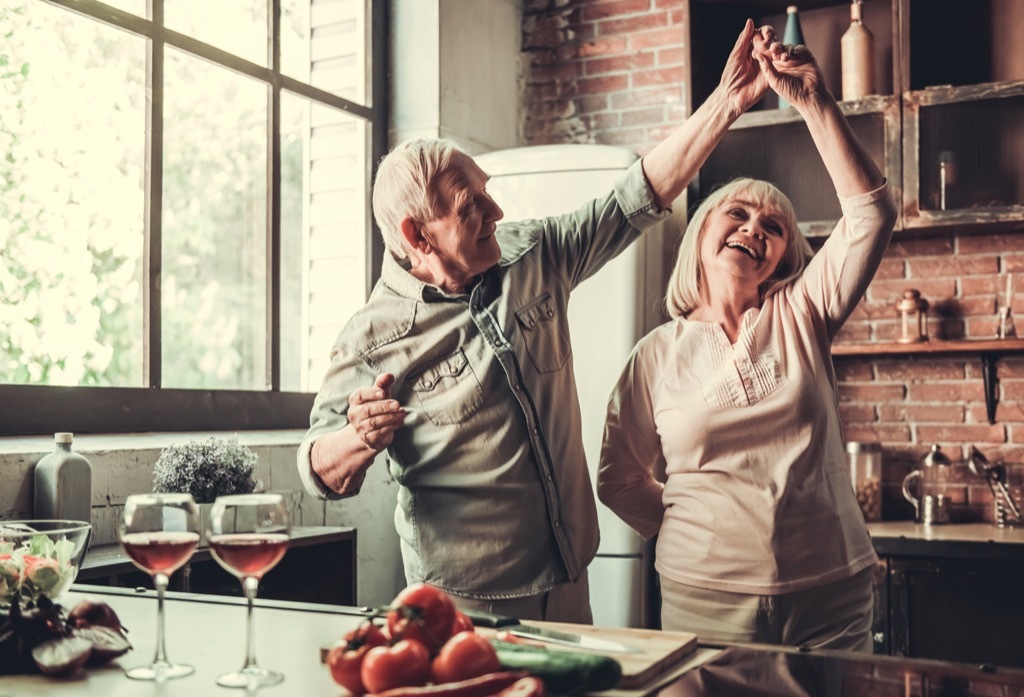 elderly couple dancing in a kitchen, healthy sex after 40