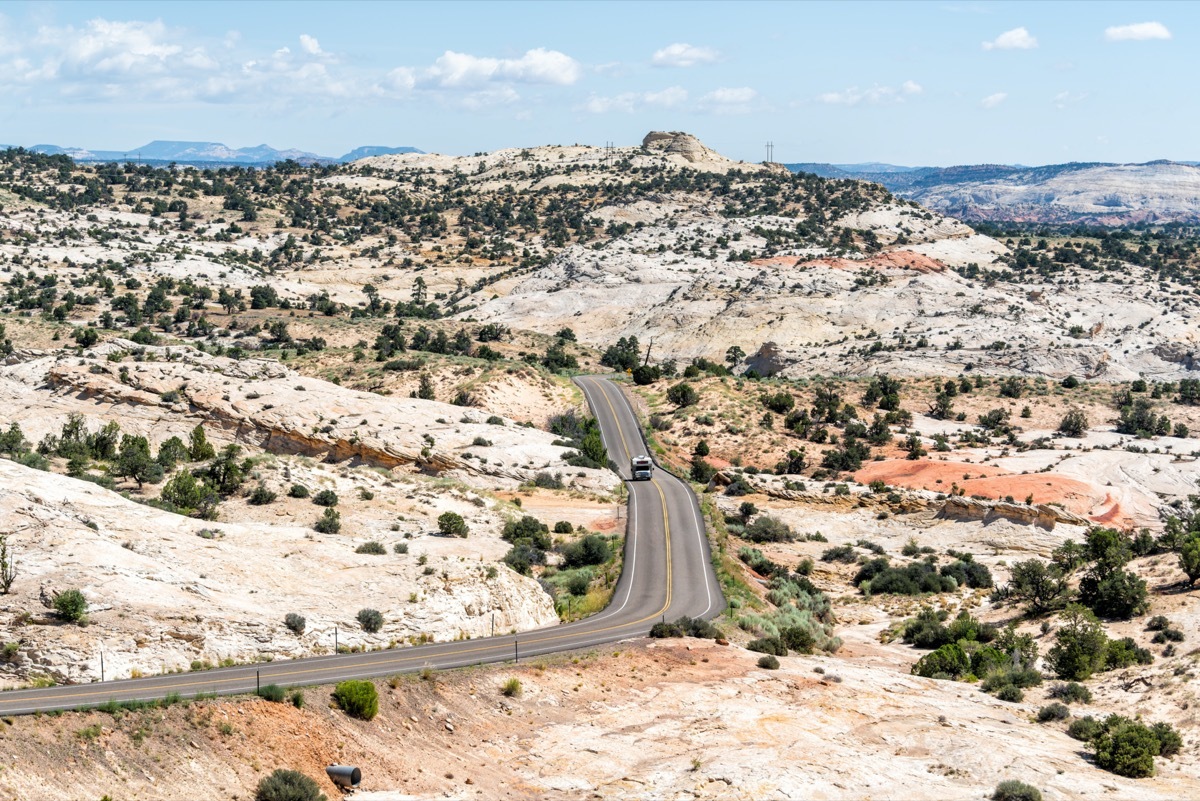 an RV drives down hell's backbone scenic byway in utah