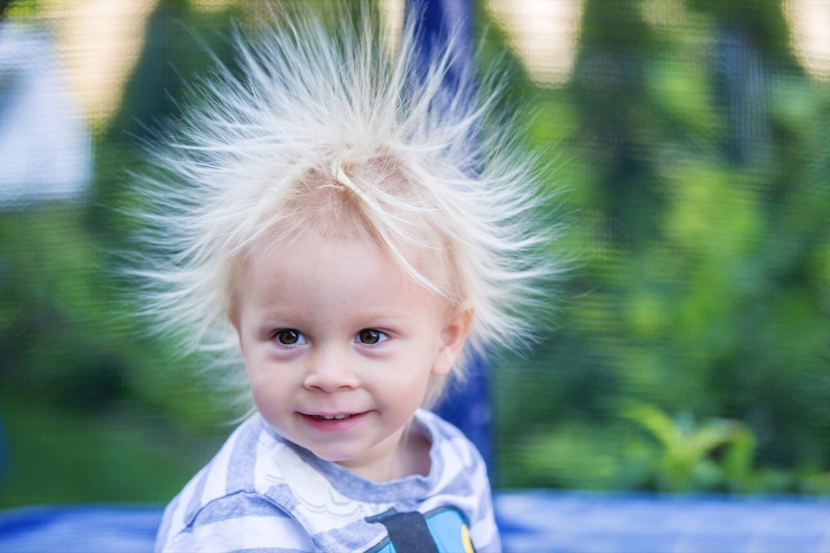 Little boy with hair standing up from static electricity