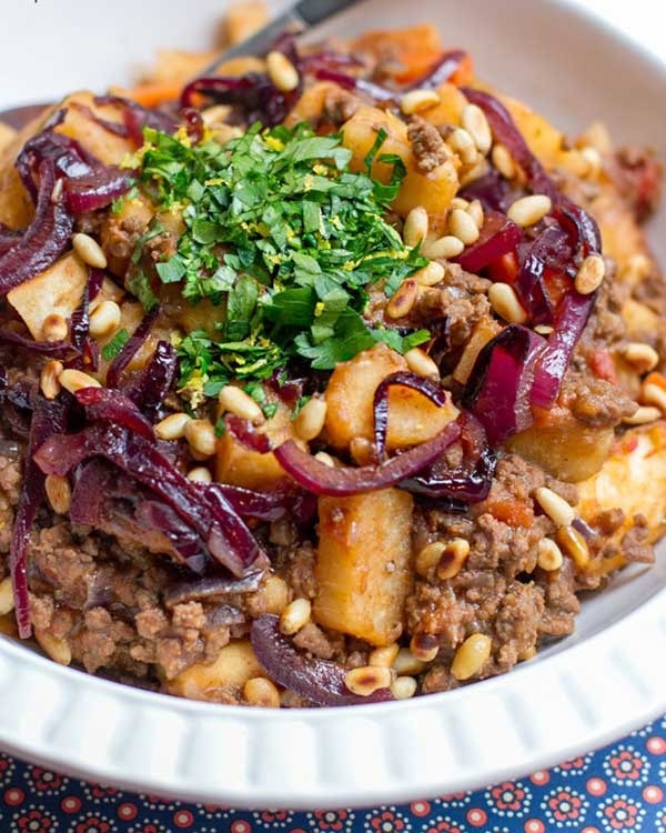 yam beef stew with caramelized onions and pine nuts