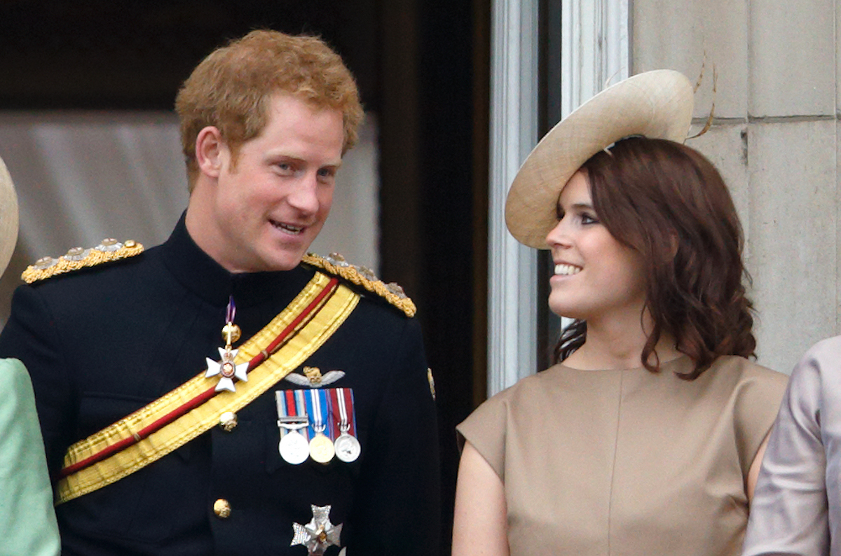 Prince Harry and Princess Eugenie stand on the balcony of Buckingham Palace