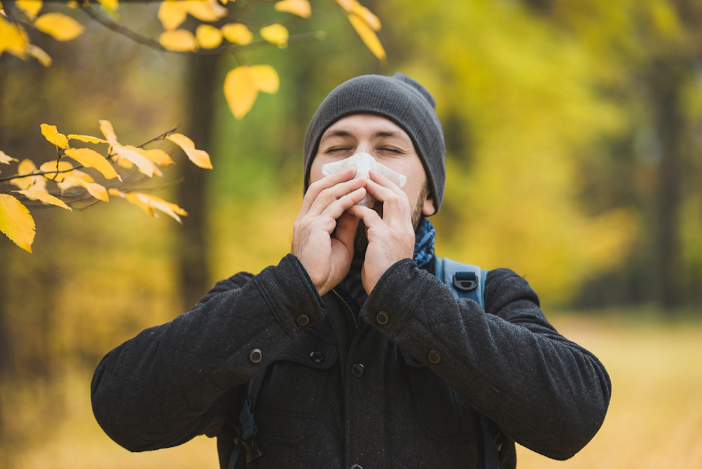 man sneezing